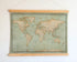 World Map Canvas with Wooden Hangers – Green & Beige
