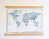 World Map Canvas with Wooden Hangers – White, Blue & Gray