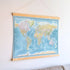 World Map Canvas with Wooden Hangers – Blue & Multicolor